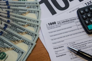 Unclaimed tax refund money with 1040 form